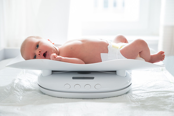 A baby being weighed